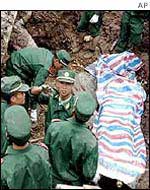 Chinese rescuers at the scene of a landslide