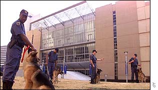 Policemen rest their dogs, near the Convention Center in Johannesburg, which is the venue for the World Summit on Sustainable Development