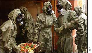 Soldiers help to clean up the damaged shop in the Karlin district, Prague 