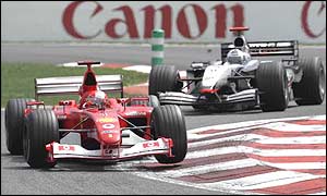 Michael Schumacher comes under pressure from David Coulthard at the French Grand Prix