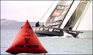 Black Magic sails around a windward mark as it leads the race from Italy's Luna Rossa