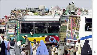 Buses loaded with belongings of returnees