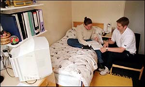 Two students in a university room