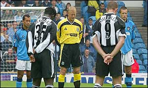 Players for Man City and Newcastle bow their heads in memory of Holly and Jessica