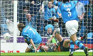 Darren Huckerby scores