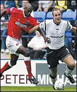 Henrik Pedersen of Bolton holds off Richard Rufus of Charlton 