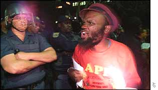 Protester confronts a policeman
