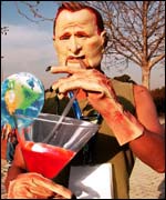 A Korean protester dressed as President Bush 