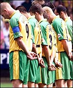 Norwich players pay their respects to Holly and Jessica before Saturday's game against Gillingham