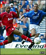 Peter Lovenkrands tries to get past Eric Deloumeaux