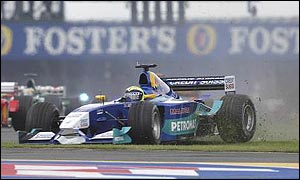 Felipe Massa bounces across the grass at the start of the British Grand Prix