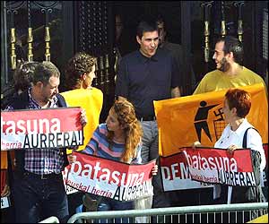 Batasuna workers - including leader Arnaldo Otegui - hold banners outside the party headquarters in Bilbao