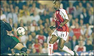 Sylvain Wiltord chips West Brom keeper Russell Hoult