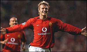 Manchester United midfielder David Beckham with Juan Sebastian Veron in the background