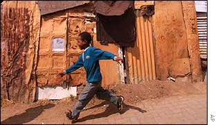 Young boy plays among shacks in Alexandra, not far from the summit venue