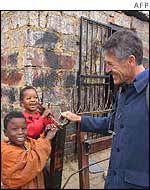French Green European Union MP Alain Lipietz meets children in the poverty stricken Alexandria township