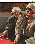 Women weep over coffin in Racak, Kosovo