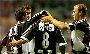 Kieron Dyer is congratulated by his team-mates after giving the Magpies the lead