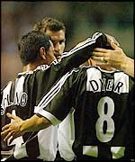 Nolberto Solano congratulates goalscorer Kieron Dyer