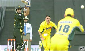 Australian wicketkeeper Adam Gilchrist collects an edge from Imran Nazir 