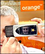 David Taylor, commercial director of Orange UK, with a mobile phone camera