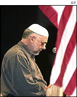 Khurshid Ali from Atlanta, Georgia, recites a prayer from the Koran