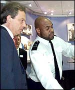 Tony Blair with a police officer