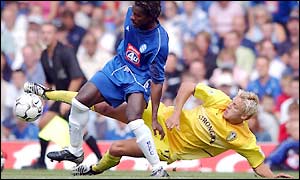 Alan Smith gets in a strong challenge for Leeds