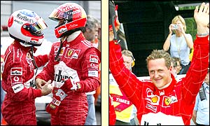 Barrichello congratulates his Ferrari team-mate Michael Schumacher on his pole position