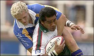 Dan Scarborough (left) fells Freddie Tuilagi
