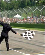 Marshall with flag at motor race
