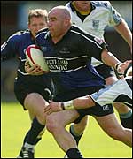 Glagow's Gordon Simpson breaks through Ryan Powell's tackle