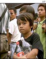 A Filipino child waits for deportation