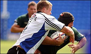 London Irish's Chris Sheasby is tackled by Bath's Andy Beattie