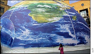 Delegate passes giant model of the world in South Africa