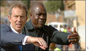 Tony Blair with Mbhazima Shilowa, premier of Gauteng Province, in Alexandra 