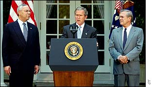 Secretary of State Colin Powell, left, President George W Bush and Defense Secretary Donald Rumsfeld