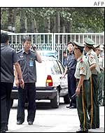 Chinese police outside the Ecuador embassy