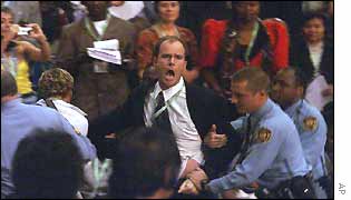 Guards remove protester