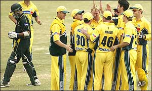 Australia's fielders rush to congratulate Jason Gillespie after he sends Imran Nazir back to the pavilion
