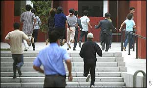 North Koreans run towards school