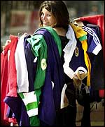 Sophie North from Christies with a selection of football shirts