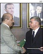 Syrian Prime Minister Mohammad Moustafa Miro (R) meets Iraqi Vice President Taha Yassin Ramadan
