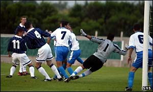 Shaun Maloney (number 11) puts Scotland ahead