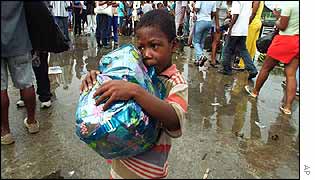 A Colombian child displaced by FARC rebel attacks prepares to return to his village