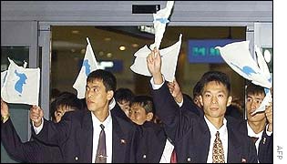 North Korean national football squad waves unification flags upon arrival at Incheon airport