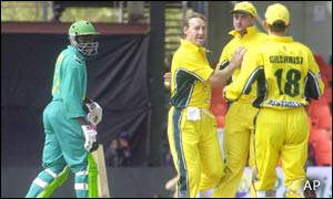 Obuya returns disconsolately to the pavilion after a first-over duck