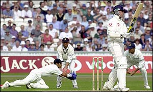 India wicketkeeper Ajay Ratra collects a ball low to his left while Marcus Trescothick holds his ground