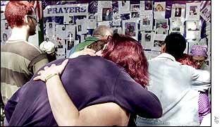 Mourners at a 'Wall of prayer' for those missing in the World Trade Center