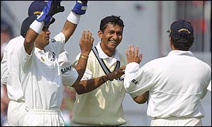 India's Sanjay Bangar celebrates the wicket of Marcus Trescothick